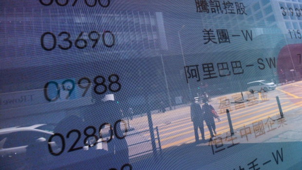 An electronic screen displays the stock codes for companies including Tencent Holdings Ltd., Meituan and Alibaba Group Holding Ltd. in Hong Kong, China, on Tuesday, March 15, 2022. Chinese stocks suffered another deep selloff on Tuesday as concerns about the country’s ties with Russia and persistent regulatory pressure sent shares on a downward spiral. Photographer: Paul Yeung/Bloomberg