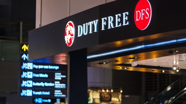 Signage is displayed atop a DFS Group Ltd. duty free store at Terminal 3 (T3) of Changi Airport in Singapore, on Thursday, Dec. 13, 2018. Singapore's Changi Airport, voted the world's best for the past six years by Skytrax, is pursuing that goal of extensive automation with such vigor that it built Terminal 4 to help test the airport bots of the future. Photographer: Nicky Loh/Bloomberg