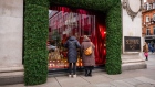 Shoppers look at a Christmas window display at the Selfridges & Co. department store in London, UK, on Friday, Nov. 3, 2023.