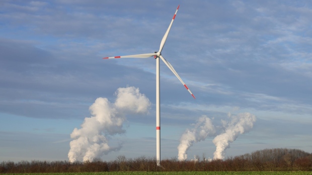 A wind turbine near a coal-fired power plant in Bergheim, Germany. 