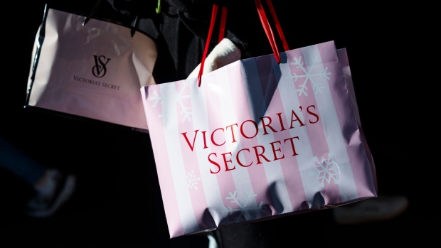 A customer holds a Victoria's Secret shopping bag in New York, US, on Sunday, Nov. 19, 2023. Victoria's Secret & Co. is scheduled to release earnings figures on November 29. Photographer: Angus Mordant/Bloomberg