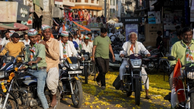 Congress supporters arrive at a rally in Banwari, Madhya Pradesh, on Nov. 15. Photographer: Kanishka Sonthalia/Bloomberg