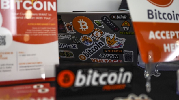 Bitcoin stickers on a laptop during the Adopting Bitcoin 2023 Summit in San Salvador, El Salvador, on Tuesday, Nov. 7, 2023. The summit in El Salvador, the world's first nation to make Bitcoin legal tender, comes on the heels of a year-long rally that saw the cryptocurrency climb above $35,000 for the first time since May 2022.