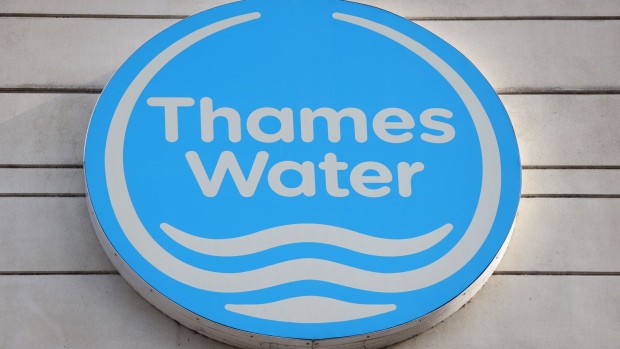 A logo outside the headquarters of Thames Water in Reading, UK, on Monday, July 3, 2023. The bonds of the UK's biggest water provider climbed on Monday as investors bet a selloff driven by fears the utility would be nationalized had gone too far. Photographer: Hollie Adams/Bloomberg