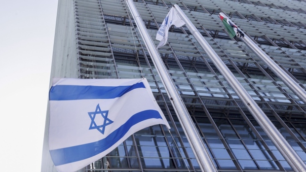 An Israeli national flag flies at half staff outside the Tel Aviv Stock Exchange in Tel Aviv, Israel, on Tuesday, Nov. 7, 2023. Photographer: Kobi Wolf/Bloomberg