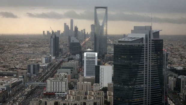 The Kingdom Tower, operated by Kingdom Holding Co., centre, stands on the skyline above the King Fahd highway in Riyadh, Saudi Arabia, on Monday, Nov. 28, 2016. Saudi Arabia and the emirate of Abu Dhabi plan to more than double their production of petrochemicals to cash in on growing demand. Photographer: Bloomberg/Bloomberg