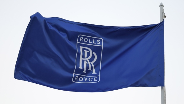 A Rolls Royce Holdings Plc flag outside the company's chalet at the Dubai Air Show in Dubai, United Arab Emirates, on Monday, Nov. 13, 2023. The 2023 Dubai Air Show kicked off on Monday with high expectations of large deals, continuing the prevailing theme of this year that’s seen airlines commit to huge orders.