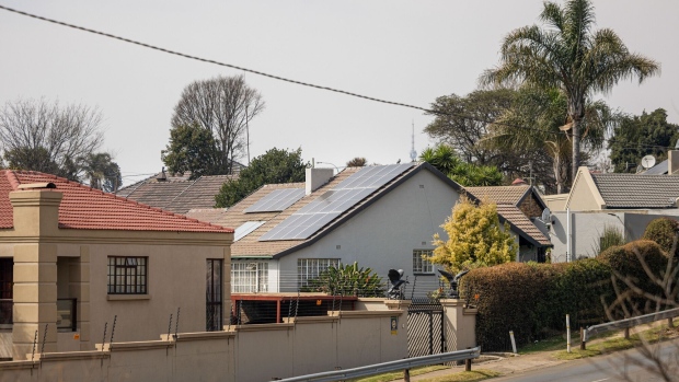 Photovoltaic solar panels on the roof of a house in Johannesburg, South Africa. Photographer: Michele Spatari/Bloomberg