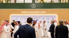 Attendees visit the Public Investment Fund (PIF) booth on day two of the Future Investment Initiative (FII) conference in Riyadh, Saudi Arabia, on Wednesday, Oct. 26, 2022. Saudi Arabia hopes the FII will put Riyadh on the map as a global destination for deals, while also improving domestic investment, which has been limited. Photographer: Tasneem Alsultan/Bloomberg