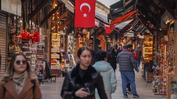 A Turkish national flag hangs above the Arasta Bazaar in Istanbul, Turkey. Photographer: David Lombeida/Bloomberg