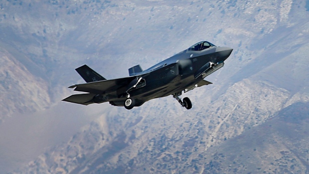 A Lockheed Martin Corp. F-35A jet flies during a training mission in Hill Air Force Base, Utah, U.S., on Friday, Oct. 21, 2016. Lockheed Martin Corp.'s accelerating revenue growth outlook is boosted by its recent portfolio moves, which are enabling the world's largest defense contractor to better capitalize on higher foreign demand. Rising F-35 production is a key driver, as deliveries are to double by 2019 vs. current levels. Photographer: George Frey/Bloomberg