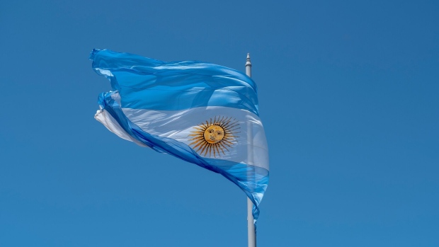 The Argentine flag in Plaza de Mayo during an inauguration ceremony in Buenos Aires, Argentina, on Sunday, Dec. 10, 2023. Javier Milei took office as Argentina's president Sunday, promising to eradicate inflation and rescue the nation's troubled economy with a shock-therapy program based on drastic cuts to public spending.