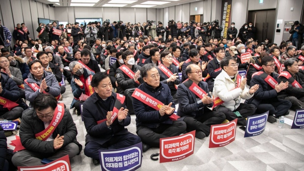 Demonstrators gather during a protest in Seoul on Feb. 25.