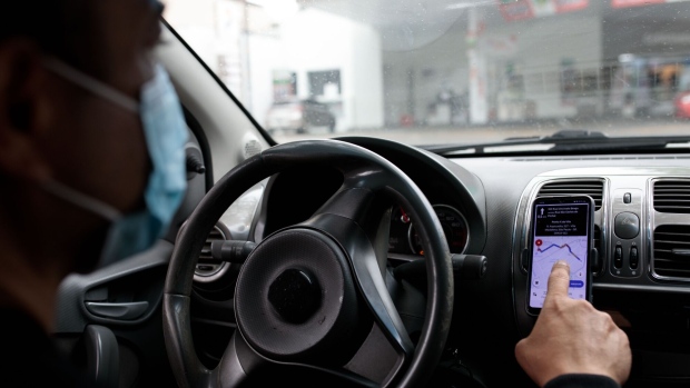 <p>An Uber driver uses a smartphone for navigation in Sao Paulo.</p>