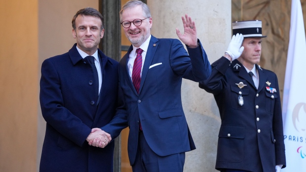 Emmanuel Macron, France’s president, left, greets Petr Fiala, Czech Republic’s prime minister, at the Elysee Palace in Paris, France, on Monday, Feb. 26, 2024. 