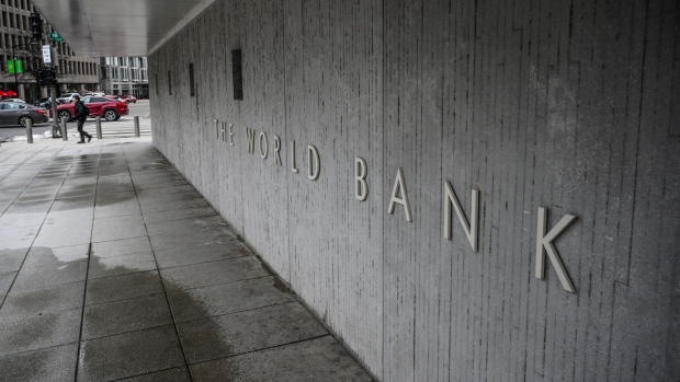 A person walks by the building of the Washington-based global development lender, The World Bank Group, in Washington on January 17, 2019. World Bank current President Jim Yong Kim announced on January 7, 2019, that he would cut short his tenure as president more than three years before his second term was to end. The World Bank Board said it would start accepting nominations for a new leader early next month and name a replacement for Kim by mid-April 2019. (Photo by Eric BARADAT / AFP) (Photo by ERIC BARADAT/AFP via Getty Images)