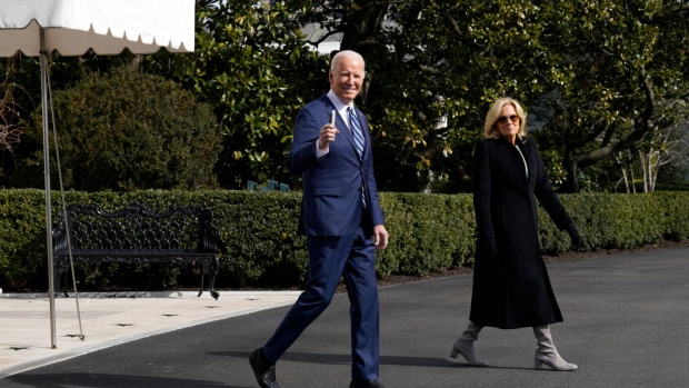 US President Joe Biden, left, and First Lady Jill Biden walk on the South Lawn of the White House before boarding Marine One in Washington, DC, US. Photographer: Yuri Gripas/Abaca/Bloomberg