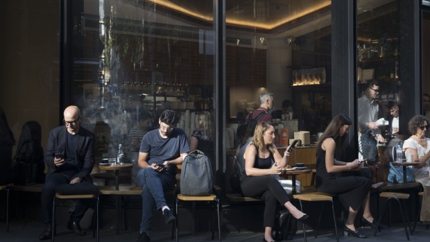 <p>Customers at a cafe in Sydney.</p>