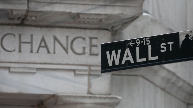 A Wall Street sign near the New York Stock Exchange (NYSE) in New York, US, on Thursday, Feb. 1, 2024. Stocks saw mild gains after data signaled further labor-market cooling in the run-up to Friday's jobs report, with traders awaiting earnings from a trio of megacaps.