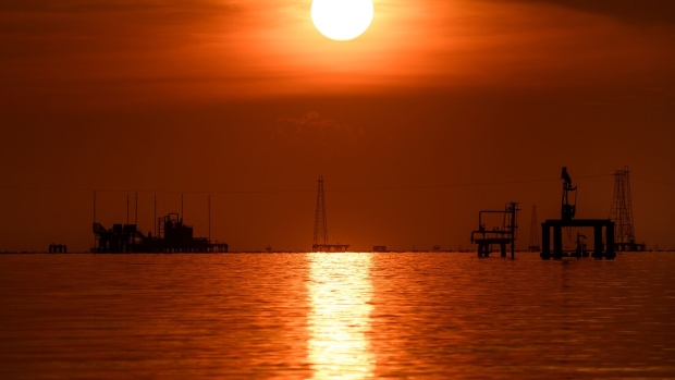 Oil rigs on lake Maracaibo in Cabimas, Zulia state, Venezuela, on Friday, Nov. 17, 2023. A decision by the US on Oct. 18 to ease sanctions in exchange for greater political freedom in Venezuela, has opened the doors for dealmaking and increased production that will enable the Latin American country's crude to reach global markets. Photographer: Gaby Oraa/Bloomberg