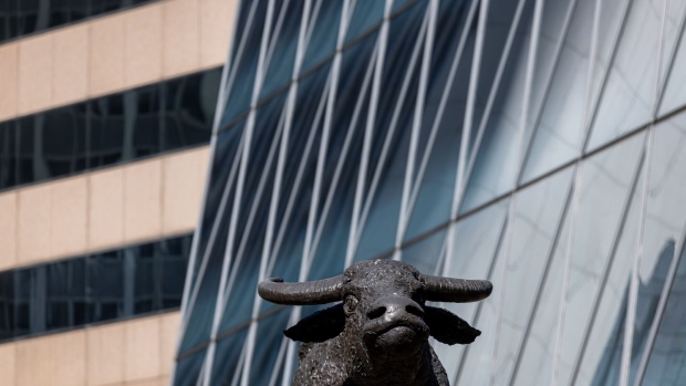 A sculpture of a water buffalo outside the Hong Kong Stock Exchange, in Hong Kong, China. Photographer: Paul Yeung/Bloomberg