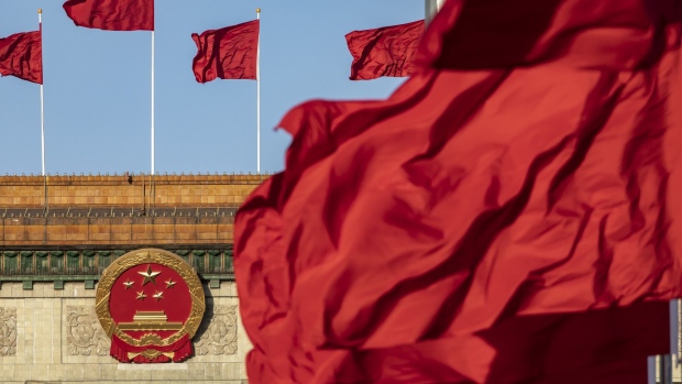 Chinese national flags fly over Tiananmen Square in Beijing. Photographer: Qilai Shen/Bloomberg