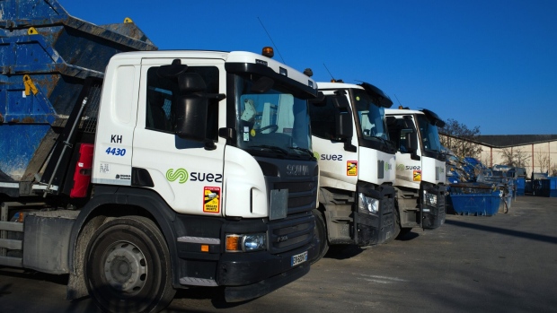 Haulage trucks at a recycling and waste recovery facility, operated by Suez SA, in Paris, France, on Sunday, Feb. 28. 2021. Suez SA set a high bar for any resumption of talks about Veolia Environnement SA’s takeover offer, after issuing yet another emphatic rejection of its rival’s proposal. Photographer: Nathan Laine/Bloomberg