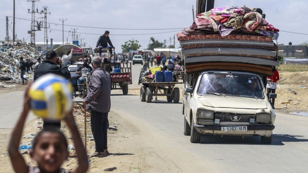 Displaced Palestinians leave with their belongings from Rafah on May 6. Source: AFP