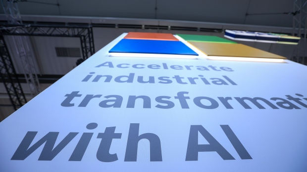 A slogan which reads "Accelerate Industrial Transformation With AI" at the Microsoft Corp. booth at the Hannover Messe 2024 trade fair in Hannover, Germany, on Monday, April 22, 2024. German Chancellor Olaf Scholz is optimistic on his country's economic prospects, citing record employment and slowing inflation thanks to falling energy costs. Photographer: Krisztian Bocsi/Bloomberg
