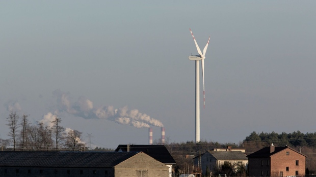 A wind turbine near the Belchatow coal powered power plant in Rusiec, Poland.