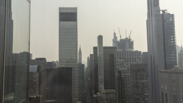 Buildings shrouded in smoke from Canada wildfires in New York, US, on Tuesday, June 6, 2023. New York City is bathed in a blanket of unhealthy air as smoke from Canadian wildfires seeps across much of the eastern US and Great Lakes areas.