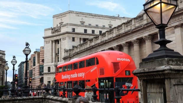 <p>A bus with an advertisement for Monzo Bank in the City of London.</p>