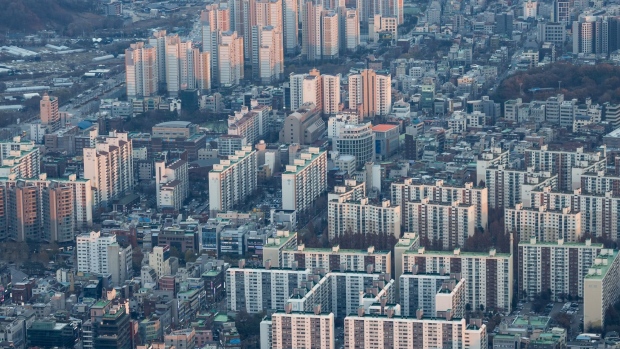 <p>Residential apartment buildings seen from the rooftop of the Lotte Corp. World Tower in Seoul.</p>
