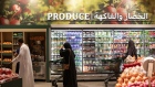 <p>Customers shop inside a Spinneys supermarket in Dubai, on May 1.</p>
