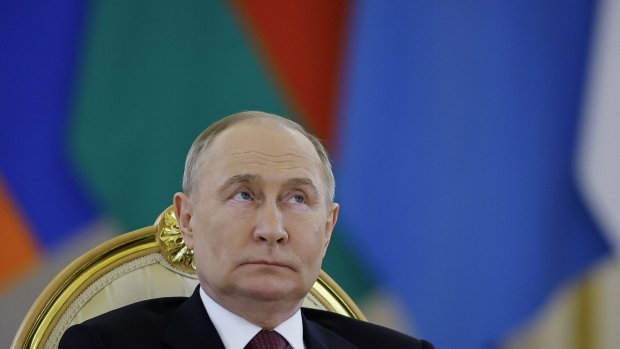 Vladimir Putin Photographer: Evgenia Novozhenina/AFP/Getty Images