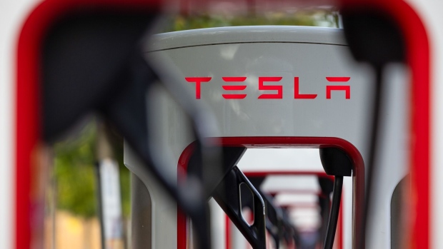 Electric vehicle supercharger charging  points, operated by Tesla Inc., in Thurrock, UK, on Friday, Sept. 22, 2023. UK Prime Minister Rishi Sunak said in a speech that he would push back by five years to 2035 a plan to bar the sale of new petrol and diesel cars, casting the decision as an effort to protect families struggling with bills. Photographer: Chris Ratcliffe/Bloomberg
