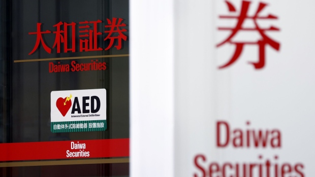 Signage for Daiwa Securities Co., a unit of Daiwa Securities Group Inc., displayed on a glass door at one of the company's branches in Tokyo, Japan, on Monday, April 25, 2022. Daiwa Securities Group is scheduled to release earnings figures on April 27.