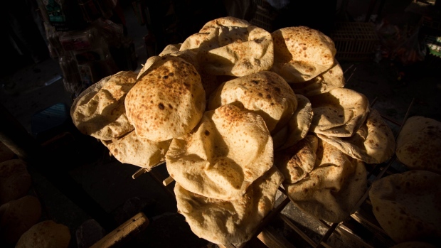 <p>Freshly baked bread for sale at the Al-Monira market in Cairo.</p>
