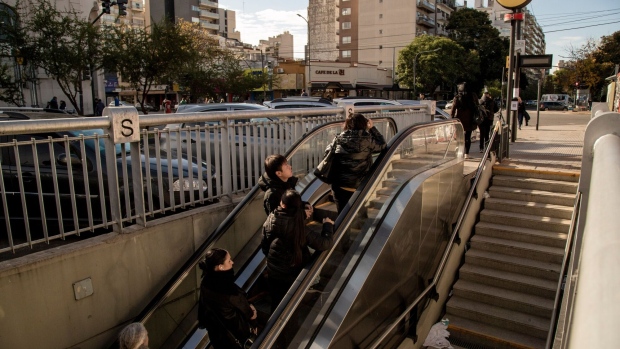 Commuters exits a subway station in Buenos Aires, which has seen colder-than-expected temperatures in recent weeks.