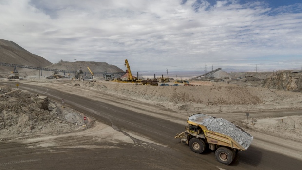 <p>A truck transports minerals inside an open pit copper mine near Calama, Chile.</p>