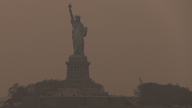 <p>The Statue of Liberty shrouded in smoke from Canada wildfires in New York on June 7, 2023. A new petition seeks to formally classify extreme heat and wildfire smoke in the US as major disasters.</p>