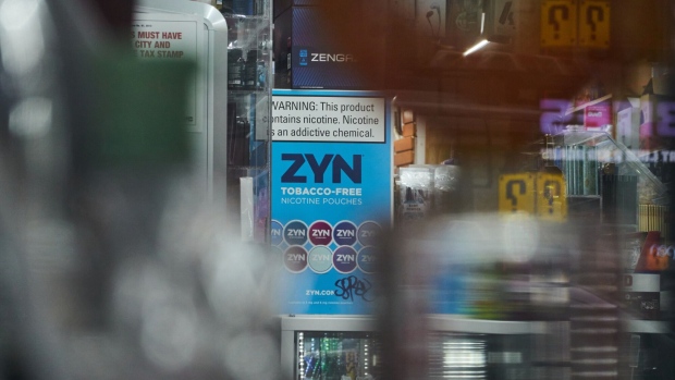 Advertising for Zyn smokeless nicotine pouches at a smoke shop in New York.