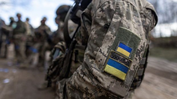 Ukrainian soldiers prepare to take part in a military training in April. Photographer: Wojtek Radwanski/AFP/Getty Images