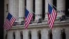American flags hang on display outside the New York Stock Exchange (NYSE) in New York, U.S., on Monday, March 5, 2018. U.S. stocks turned higher and Treasuries erased gains as investors speculated that President Donald Trump's tough tariff talk won't translate into the most severe protectionist policies. Photographer: Michael Nagle/Bloomberg