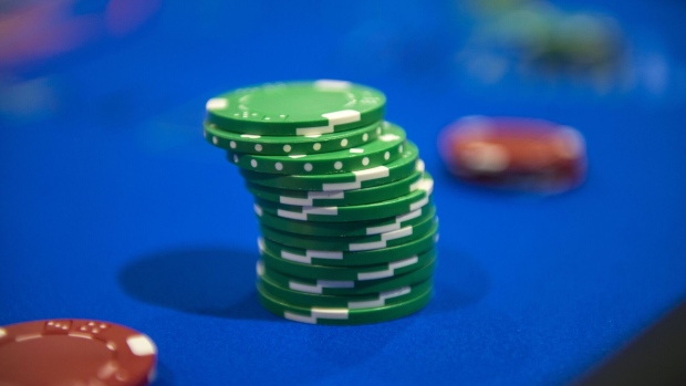 Chips sit stacked in a game of poker during the 2016 Global Gaming Expo (G2E) at the Las Vegas Sands Corp. Expo and Convention Center in Las Vegas, Nevada, U.S., on Tuesday, Sept. 27, 2016. The G2E is an international gaming trade show that gives a looking into the casino, hospitality, and food and beverage industry. Photographer: Jacob Kepler/Bloomberg