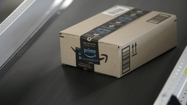 A box moves along a conveyor belt at an Amazon fulfilment centre in Sydney, Australia, on Tuesday, July 5, 2022. Amazon.com Inc. became the third US tech giant to be subject to Germany's tough new antitrust rules targeting the dominance of a handful of powerful digital firms, and will also face a separate probe in the UK. Photographer: Brent Lewin/Bloomberg