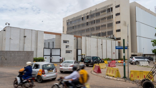 Vehicles travel past the Bank of Ghana, Ghana's central bank, in Accra, Republic of Ghana, on Monday, March 27, 2023. Ghana’s central bank extended its steepest-ever phase of monetary tightening to re-anchor inflation expectations. Photographer: Ernest Ankomah/Bloomberg