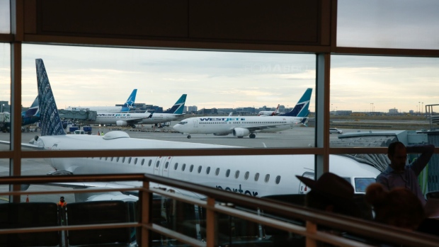 <p>WestJet planes at Toronto Pearson International Airport.</p>