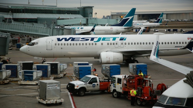 <p>WestJet planes at Toronto Pearson International Airport.</p>