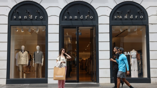 Shoppers pass a Sandro luxury clothing store in the Covent Garden district of London, UK, on Thursday, June 20, 2024. British inflation fell back to the Bank of England’s 2% target for the first time in almost three years. Photographer: Hollie Adams/Bloomberg